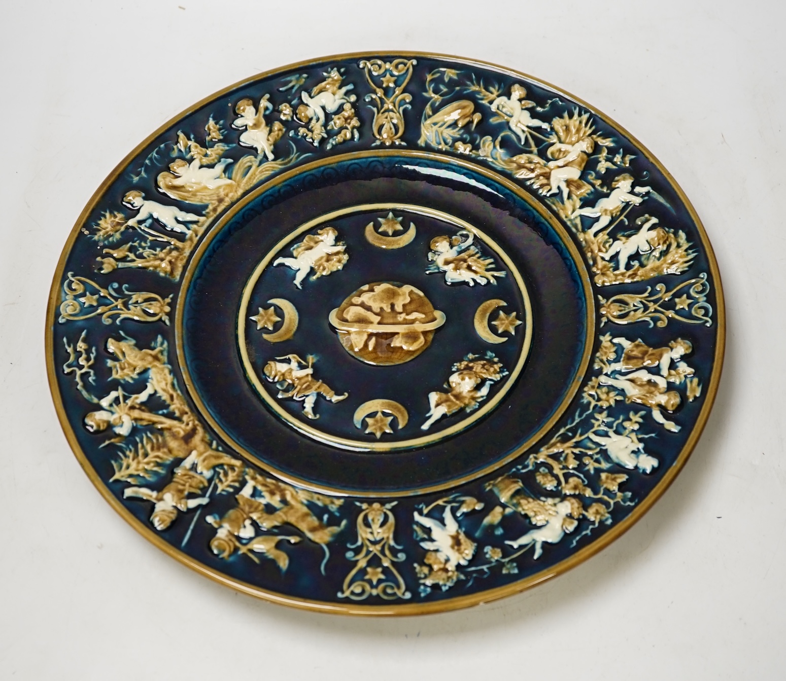 A late 19th century Schulz Blansko majolica relief wall plate, 36cm in diameter. Condition - good